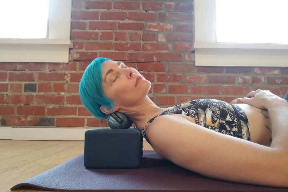 Neck release pose using massage balls